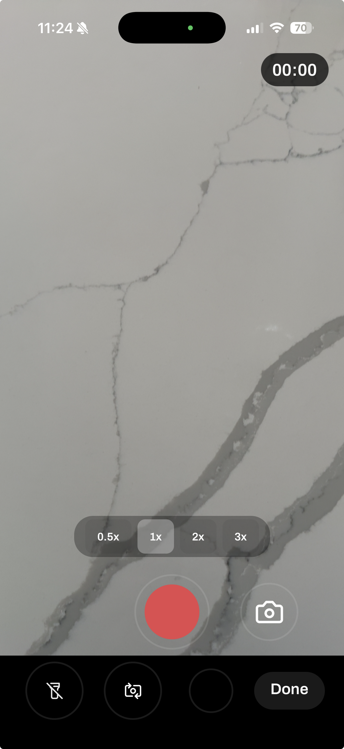 Site visit camera view with record button, zoom controls, and a Done button
