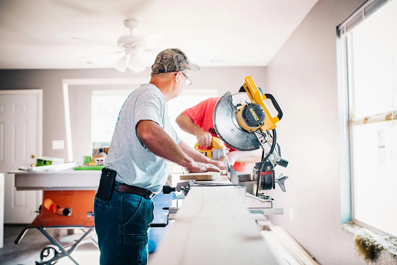 Contractor using a chop saw on a jobsite